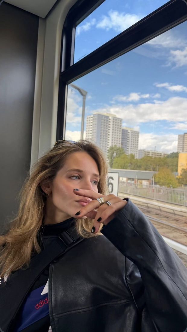 Woman looking out of a train window